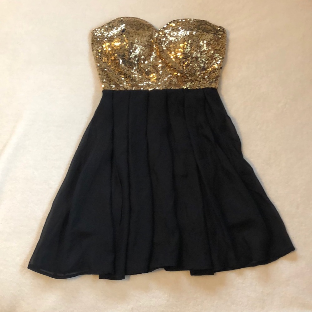 Black and gold sequin dress